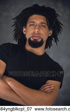 Picture - low angle view 
of african man 
with arms crossed. 
fotosearch - search 
stock photos, 
pictures, images, 
and photo clipart