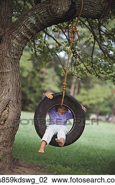 Stock Photo - young girl sitting 
in tire swing. 
fotosearch - search 
stock photos, 
pictures, images, 
and photo clipart