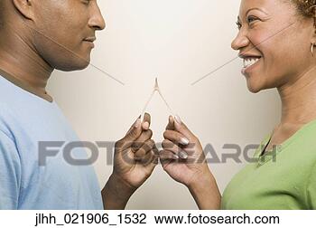 Stock Photo - african couple 
holding wishbone. 
fotosearch - search 
stock photos, 
pictures, images, 
and photo clipart