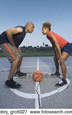 Picture - african man and 
woman on basketball 
court. fotosearch 
- search stock 
photos, pictures, 
images, and photo 
clipart