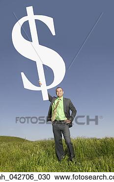 Stock Photography - asian businessman 
holding dollar 
sign in field. 
fotosearch - search 
stock photos, 
pictures, images, 
and photo clipart