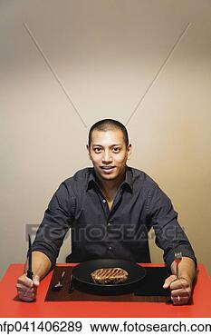 Stock Photograph - asian man at dinner 
table with steak. 
fotosearch - search 
stock photos, 
pictures, images, 
and photo clipart