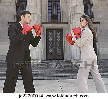Stock Photo - businessman and 
businesswoman 
sparring in front 
of building. fotosearch 
- search stock 
photos, pictures, 
images, and photo 
clipart