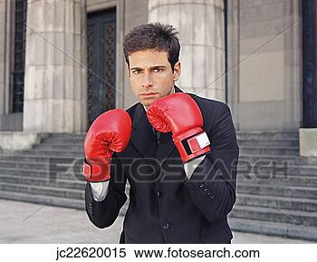 Stock Image - businessman wearing 
boxing gloves. 
fotosearch - search 
stock photos, 
pictures, images, 
and photo clipart