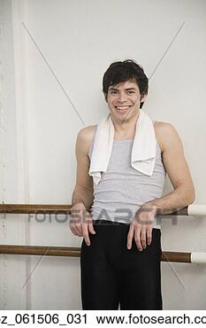 Stock Photography - portrait of hispanic 
male doctor leaning 
against ballet 
bar. fotosearch 
- search stock 
photos, pictures, 
images, and photo 
clipart