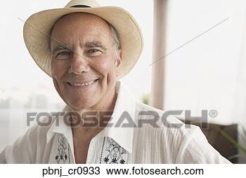 Stock Photo - portrait of senior 
man wearing hat. 
fotosearch - search 
stock photos, 
pictures, images, 
and photo clipart