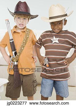 Picture - two young boys 
dressed as cowboys. 
fotosearch - search 
stock photos, 
pictures, images, 
and photo clipart