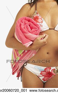 Stock Photography - woman wearing 
bikini and holding 
towel. fotosearch 
- search stock 
photos, pictures, 
images, and photo 
clipart
