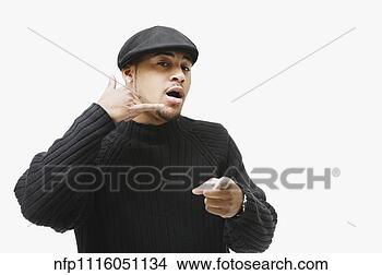 Stock Photo - african man making 
telephone hand 
gesture and pointing. 
fotosearch - search 
stock photos, 
pictures, images, 
and photo clipart