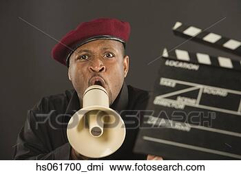 Stock Photo - african man shouting 
in megaphone and 
holding clapperboard. 
fotosearch - search 
stock photos, 
pictures, images, 
and photo clipart