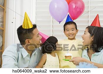Stock Photo - asian boy celebrating 
birthday with 
family. fotosearch 
- search stock 
photos, pictures, 
images, and photo 
clipart