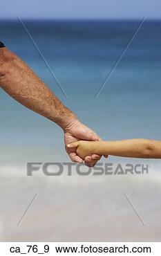 Stock Photograph - father and child 
holding hands 
at beach. fotosearch 
- search stock 
photos, pictures, 
images, and photo 
clipart