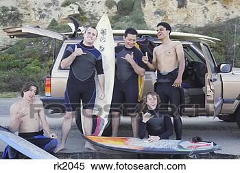 Stock Image - multi-ethnic surfers 
being silly next 
to truck. fotosearch 
- search stock 
photos, pictures, 
images, and photo 
clipart