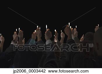 Stock Photo - people holding 
lit lighters up 
in air. fotosearch 
- search stock 
photos, pictures, 
images, and photo 
clipart
