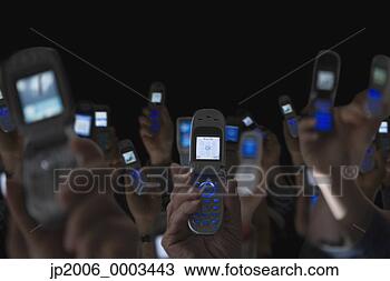 Stock Photo - people holding 
open cell phones 
up in air. fotosearch 
- search stock 
photos, pictures, 
images, and photo 
clipart