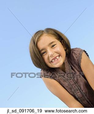 Stock Photograph - portrait of hispanic 
girl under blue 
sky. fotosearch 
- search stock 
photos, pictures, 
images, and photo 
clipart