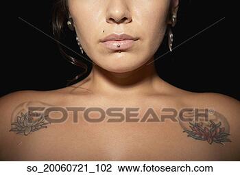 Stock Photo - portrait of woman 
with piercings 
and tattoos. fotosearch 
- search stock 
photos, pictures, 
images, and photo 
clipart
