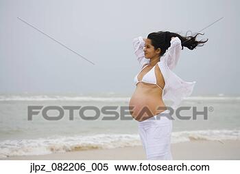 Stock Image - pregnant hispanic 
woman at beach. 
fotosearch - search 
stock photos, 
pictures, images, 
and photo clipart