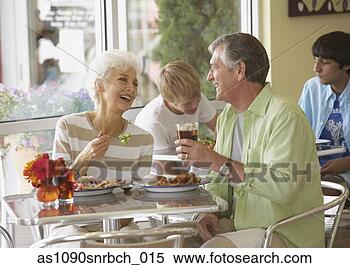 Stock Image - senior couple 
eating at restaurant. 
fotosearch - search 
stock photos, 
pictures, images, 
and photo clipart