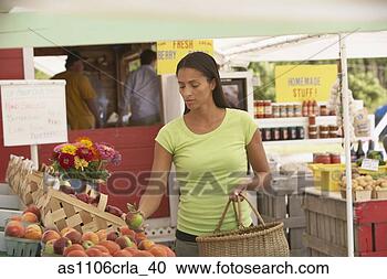 Stock Photography - african woman 
choosing fruit 
at outdoor market. 
fotosearch - search 
stock photos, 
pictures, images, 
and photo clipart