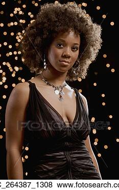 Stock Photo - african woman 
in evening dress 
with lights in 
background. fotosearch 
- search stock 
photos, pictures, 
images, and photo 
clipart