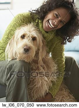 Stock Photography - african woman 
hugging dog. fotosearch 
- search stock 
photos, pictures, 
images, and photo 
clipart