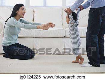 Stock Image - asian parents 
helping baby walk. 
fotosearch - search 
stock photos, 
pictures, images, 
and photo clipart
