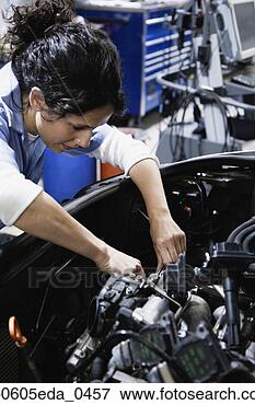 Picture - close up of female 
auto mechanic 
working on engine 
in auto repair 
shop. fotosearch 
- search stock 
photos, pictures, 
images, and photo 
clipart