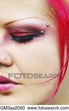 Stock Photography - close up of hispanic 
woman with vibrant 
make-up and facial 
piercings. fotosearch 
- search stock 
photos, pictures, 
images, and photo 
clipart