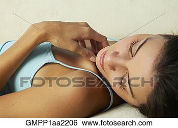 Stock Photo - close up of hispanic 
woman laying down 
with eyes closed. 
fotosearch - search 
stock photos, 
pictures, images, 
and photo clipart