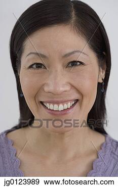 Stock Photograph - close up of middle-aged 
asian woman smiling. 
fotosearch - search 
stock photos, 
pictures, images, 
and photo clipart