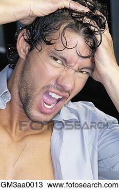 Stock Photo - close up of young 
man yelling with 
hands on head. 
fotosearch - search 
stock photos, 
pictures, images, 
and photo clipart