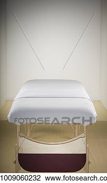 Stock Photo - empty massage 
table in room. 
fotosearch - search 
stock photos, 
pictures, images, 
and photo clipart