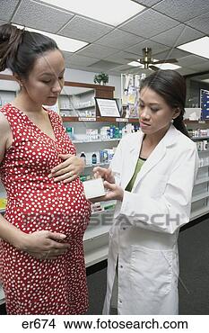 Stock Photo - female pharmacist 
discussing medication 
with pregnant 
asian woman. fotosearch 
- search stock 
photos, pictures, 
images, and photo 
clipart