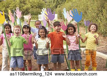 Stock Photo - group of children 
standing in garden 
with hand cut-out 
decorations. fotosearch 
- search stock 
photos, pictures, 
images, and photo 
clipart
