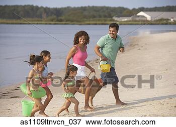 Picture - hispanic family 
running on beach. 
fotosearch - search 
stock photos, 
pictures, images, 
and photo clipart