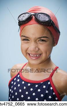 Stock Image - hispanic girl 
in bathing suit 
with goggles and 
swim cap. fotosearch 
- search stock 
photos, pictures, 
images, and photo 
clipart