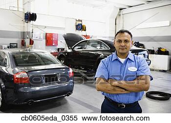 Stock Image - hispanic male 
auto mechanic 
standing in auto 
repair shop. fotosearch 
- search stock 
photos, pictures, 
images, and photo 
clipart