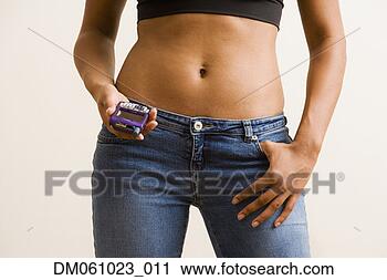 Stock Photography - hispanic woman 
with bare torso 
holding cell phone. 
fotosearch - search 
stock photos, 
pictures, images, 
and photo clipart