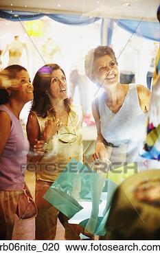 Stock Photography - hispanic women 
with shopping 
bags window shopping. 
fotosearch - search 
stock photos, 
pictures, images, 
and photo clipart
