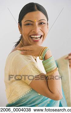 Stock Photo - indian woman in 
traditional clothing 
smiling. fotosearch 
- search stock 
photos, pictures, 
images, and photo 
clipart