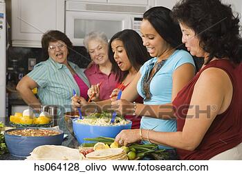 Stock Photo - large hispanic 
family in kitchen 
preparing food. 
fotosearch - search 
stock photos, 
pictures, images, 
and photo clipart