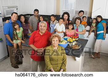 Stock Photo - large hispanic 
family in kitchen 
with food. fotosearch 
- search stock 
photos, pictures, 
images, and photo 
clipart