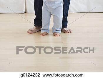 Stock Photo - low section of 
barefoot baby 
and father. fotosearch 
- search stock 
photos, pictures, 
images, and photo 
clipart