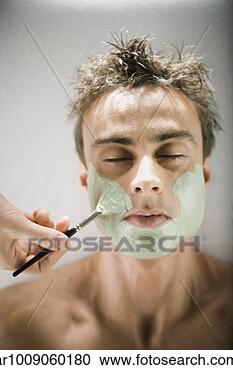 Stock Photography - man receiving 
spa facial treatment. 
fotosearch - search 
stock photos, 
pictures, images, 
and photo clipart