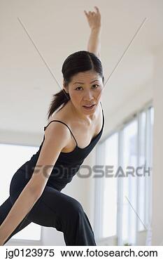 Stock Image - middle-aged asian 
female dancer 
practicing. fotosearch 
- search stock 
photos, pictures, 
images, and photo 
clipart