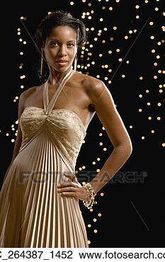 Stock Photo - portrait of african 
woman wearing 
evening dress. 
fotosearch - search 
stock photos, 
pictures, images, 
and photo clipart