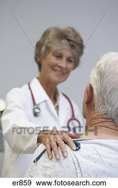 Stock Photograph - senior female 
doctor reassuring 
senior male patient. 
fotosearch - search 
stock photos, 
pictures, images, 
and photo clipart