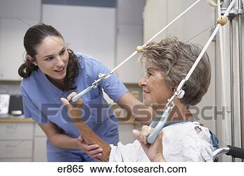 Stock Image - senior female 
patient performing 
physical therapy 
with nurse. fotosearch 
- search stock 
photos, pictures, 
images, and photo 
clipart