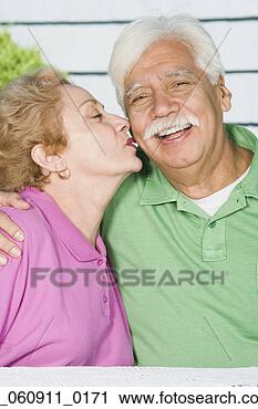 Stock Photography - senior hispanic 
woman kissing 
husband’s cheek. 
fotosearch - search 
stock photos, 
pictures, images, 
and photo clipart